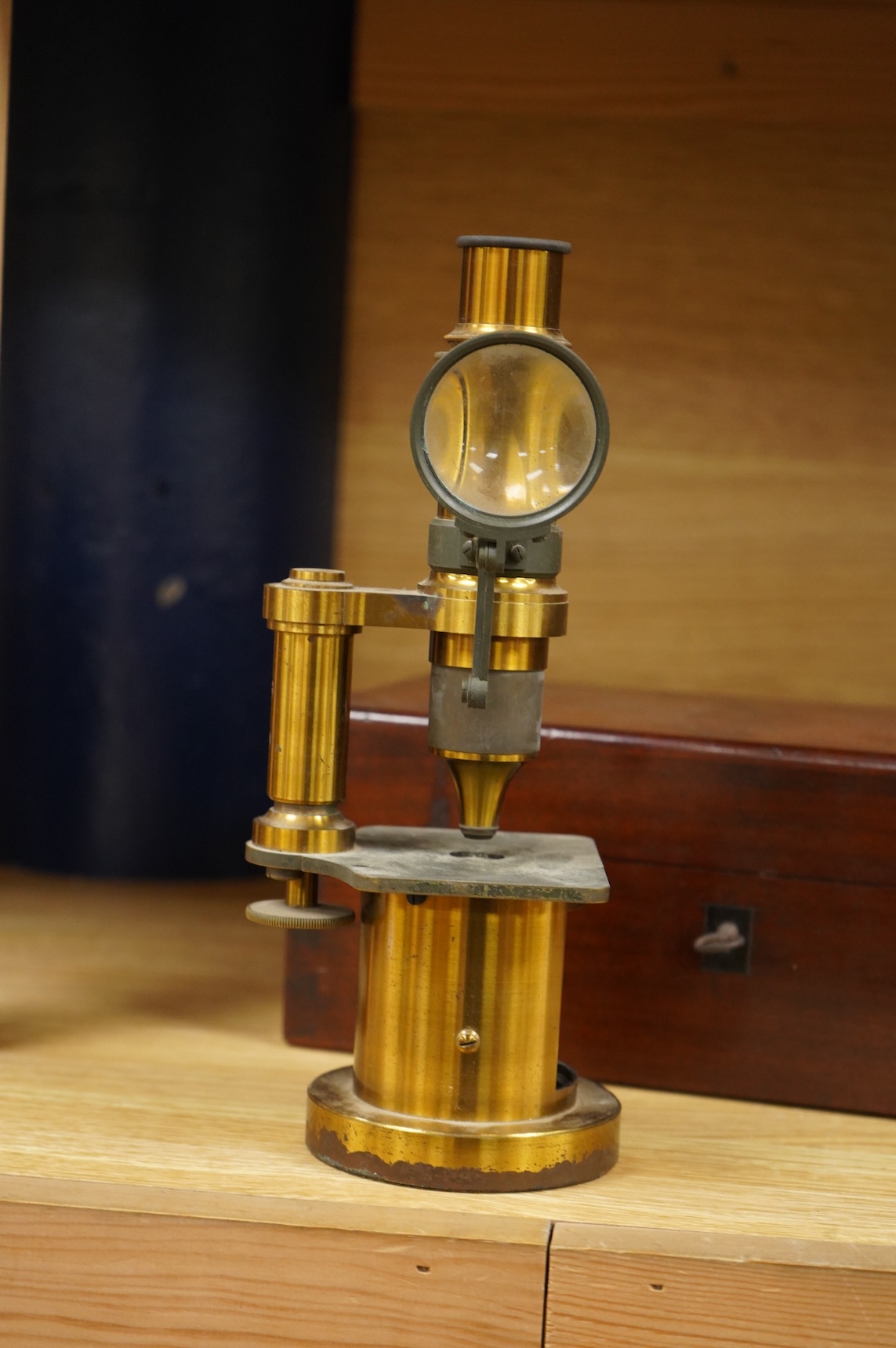 A mid 19th century French brass compound monocular microscope, by G. Oberhaeuser & E. Hartnack, Place Dauphine, Paris, number 2953, with an additional eyepiece, an objective and small box of slides, mahogany case 25.5cm